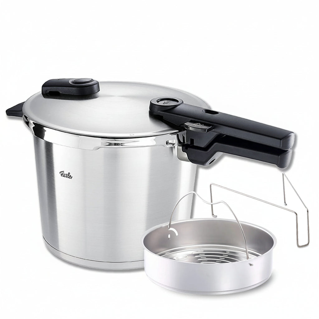 Stainless steel pressure cooker with steamer insert on a white background