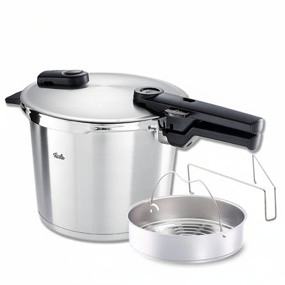 Stainless steel pressure cooker with steamer insert on a white background